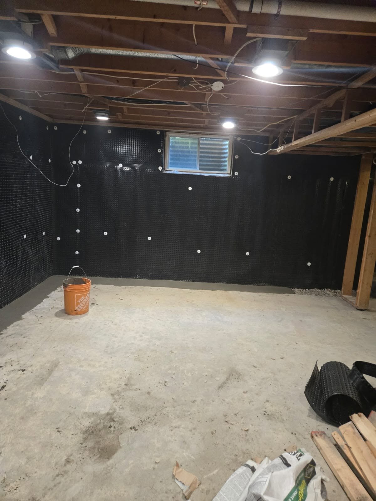 Sequenced underpinning pit with wood formwork in place